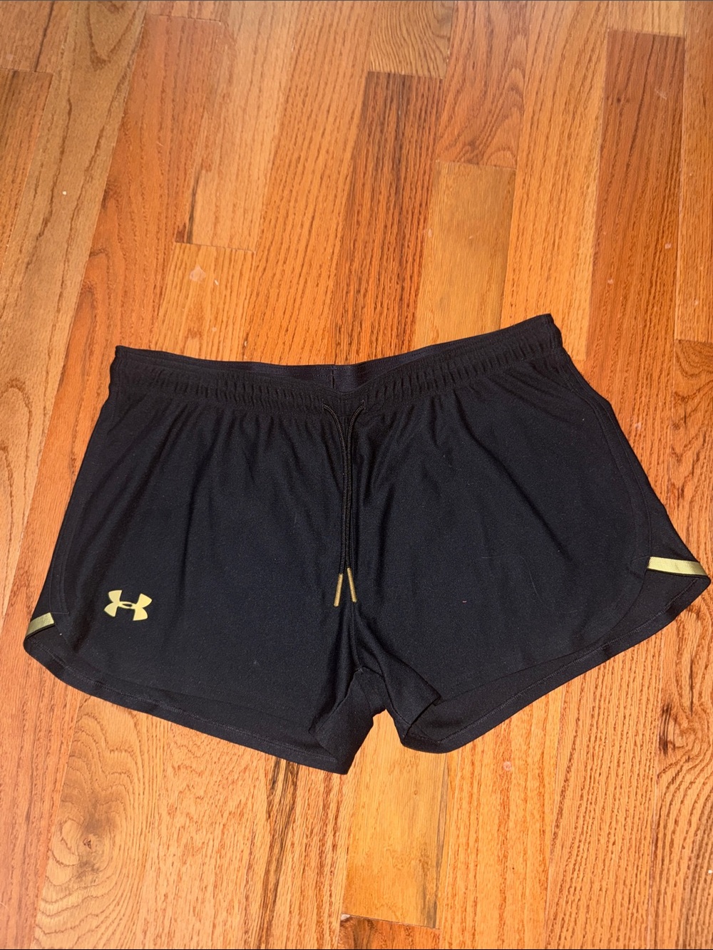 Under Armour Black Women’s Athletic Shorts with Gold Logo